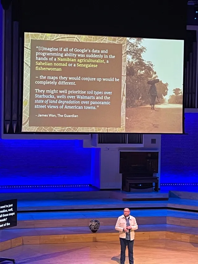 Photo: May Viratikul: Per Axbom on stage at Camp Digital 2025. A quote from James Wan in The Guardian on how differently maps would look if made by others.