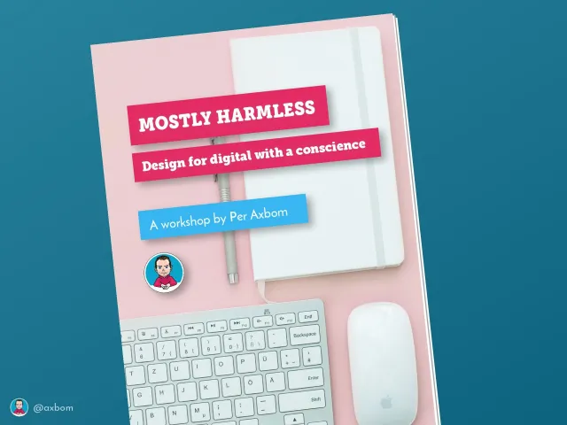 Workshop title slide: “Mostly Harmless – Design for digital with a conscience. A workshop by Per Axbom”, on a workbook cover lying on a pink desk with a keyboard, a mouse and a notebook.