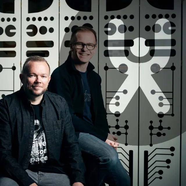 Cover art: James Royal-Lawson and Per Axbom in front of a wall with the UX Podcast logo.